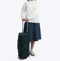 Vintage green rolling duffel bag