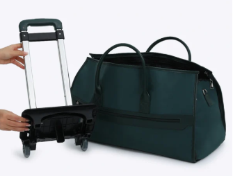 Vintage green rolling duffel bag