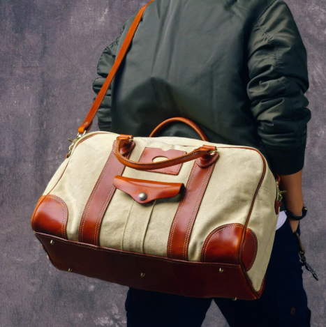 Large weekend travel bag in a combination of canvas and Italian leather