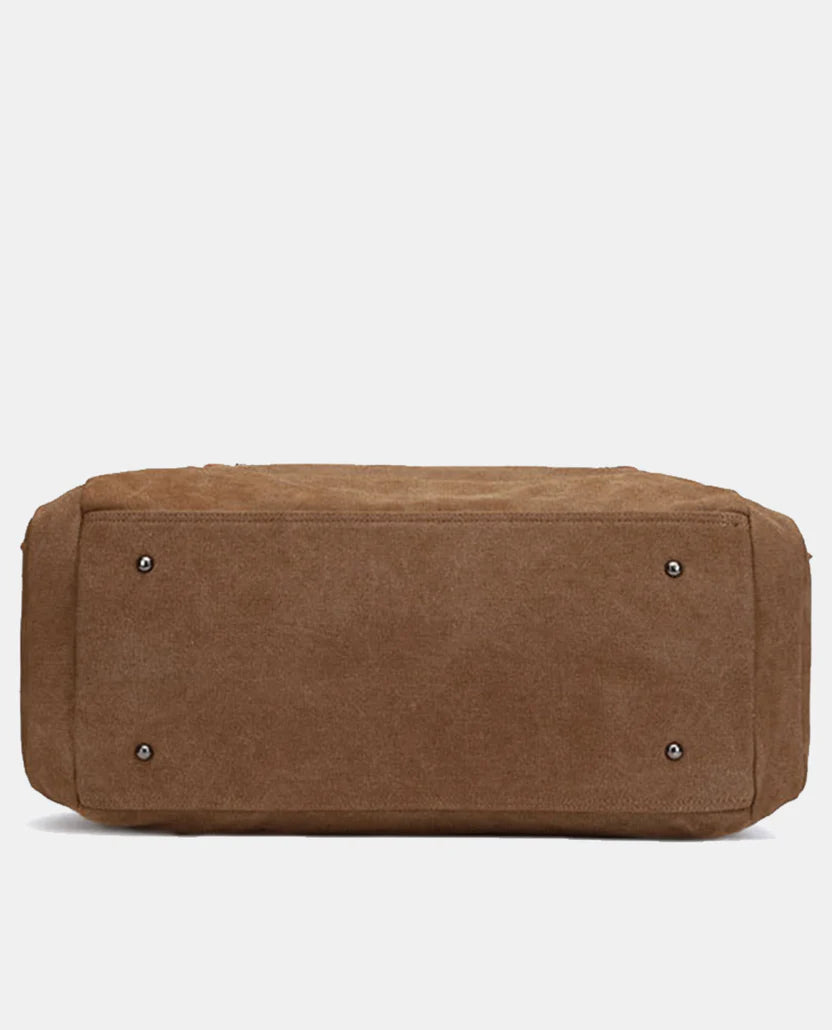 Water-resistant canvas travel bag—large weekend bag with leather trim