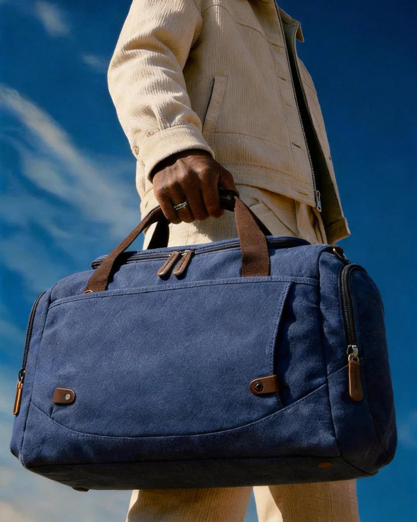 Water-resistant canvas travel bag—large weekend bag with leather trim
